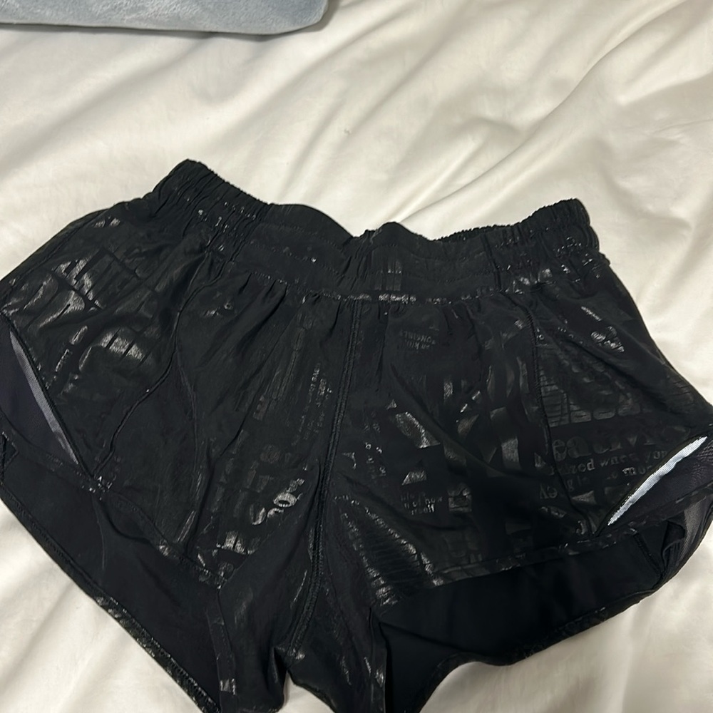 Lululemon black hotty hot shorts with writing. Low rise, size 6, 2.5” inseam